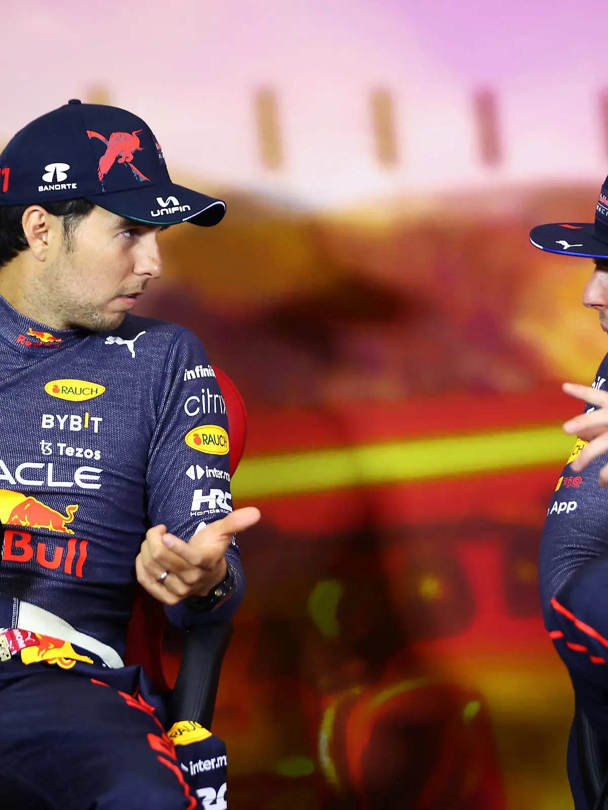 BARCELONA, SPAIN - MAY 22: Race winner Max Verstappen of the Netherlands and Oracle Red Bull Racing and Second placed Sergio Perez of Mexico and Oracle Red Bull Racing talk in the press conference after the F1 Grand Prix of Spain at Circuit de Barcelona-Catalunya on May 22, 2022 in Barcelona, Spain. (Photo by Dan Istitene/Getty Images)