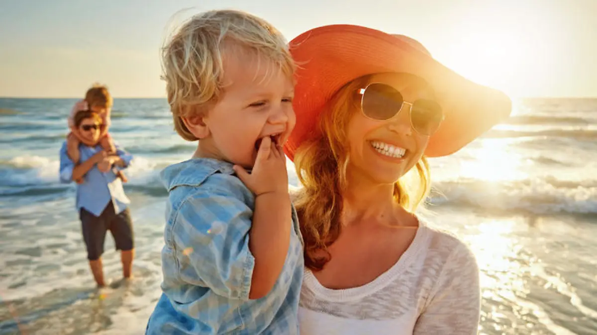 Shot of a young family enjoying a day at the beach