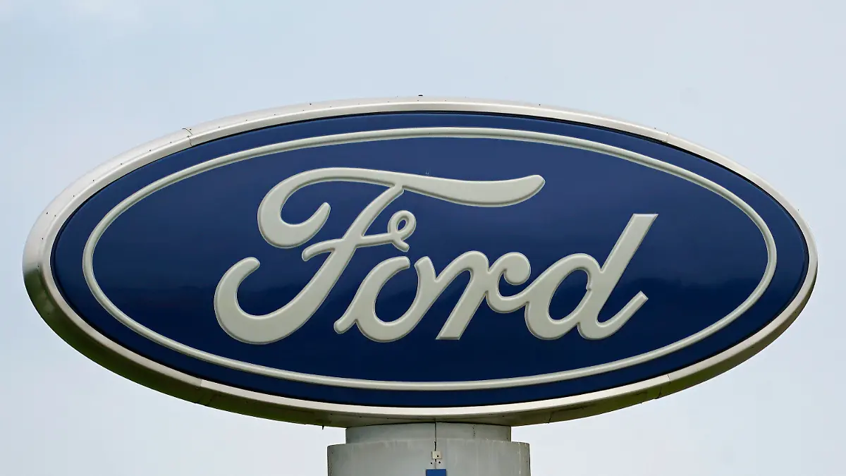 FILE - A Ford logo is seen on signage at Country Ford in Graham, N.C., Tuesday, July 27, 2021. Ford is issuing two recalls covering over 737,000 vehicles, Friday, April 1, 2022, to fix oil leaks and trailer braking systems that won't work. Ford says in government documents posted Thursday, May 19, 2022, is asking the owners of 350,000 vehicles in to take them to dealers for repairs in three recalls, including about 39,000 that should be parked outdoors because the engines can catch fire. (AP Photo/Gerry Broome, File)