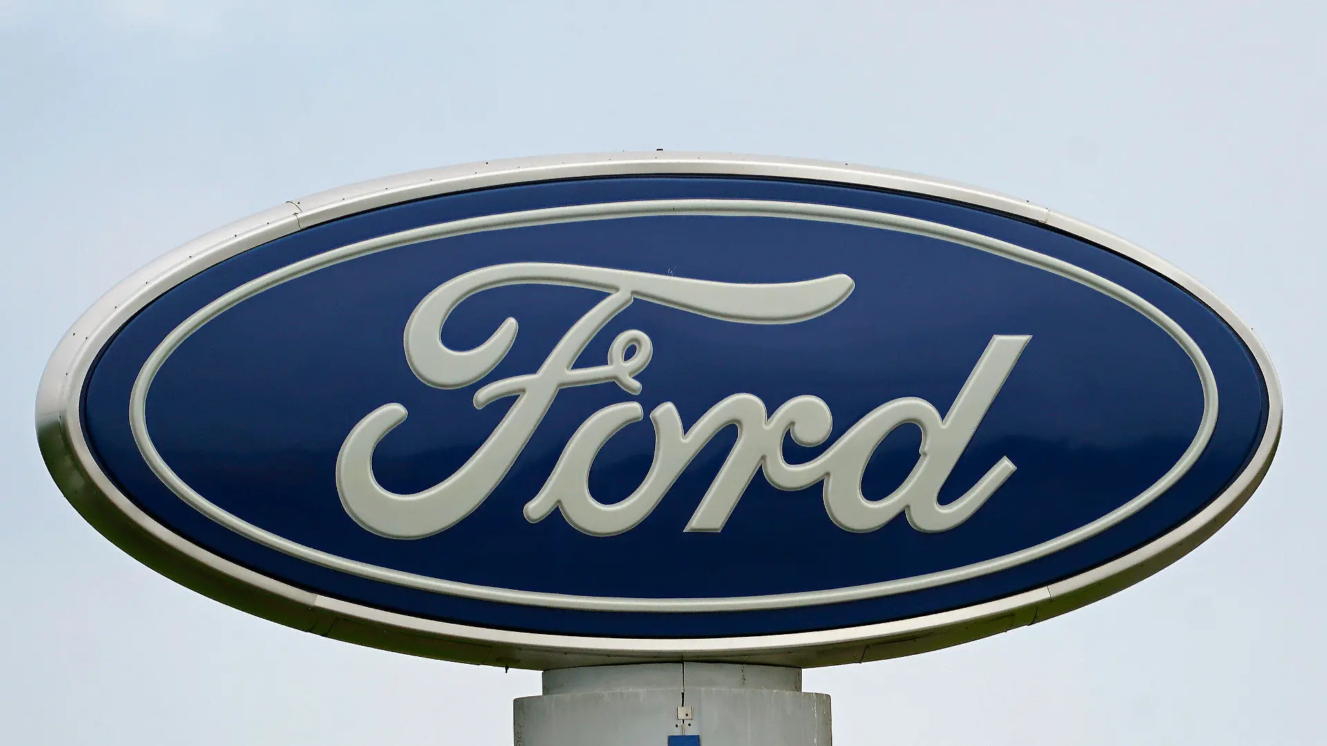 FILE - A Ford logo is seen on signage at Country Ford in Graham, N.C., Tuesday, July 27, 2021. Ford is issuing two recalls covering over 737,000 vehicles, Friday, April 1, 2022, to fix oil leaks and trailer braking systems that won't work. Ford says in government documents posted Thursday, May 19, 2022, is asking the owners of 350,000 vehicles in to take them to dealers for repairs in three recalls, including about 39,000 that should be parked outdoors because the engines can catch fire. (AP Photo/Gerry Broome, File)