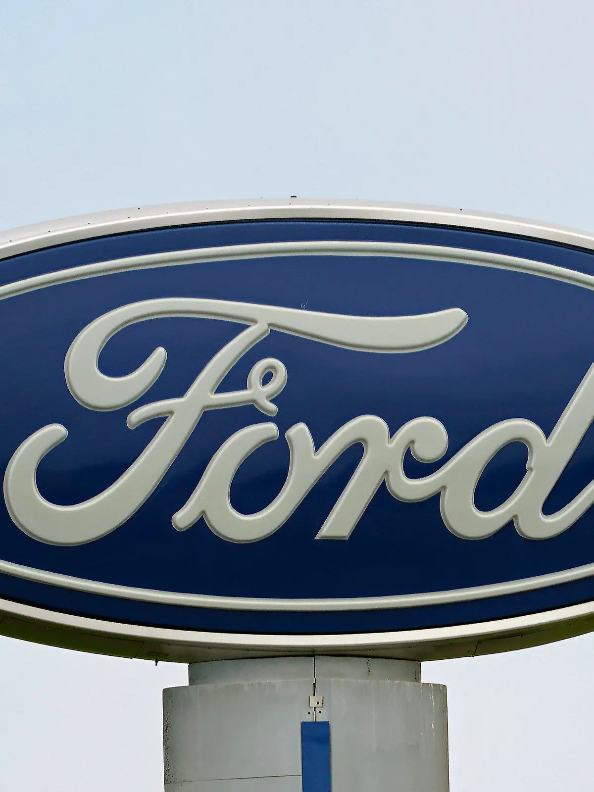 FILE - A Ford logo is seen on signage at Country Ford in Graham, N.C., Tuesday, July 27, 2021. Ford is issuing two recalls covering over 737,000 vehicles, Friday, April 1, 2022, to fix oil leaks and trailer braking systems that won't work. Ford says in government documents posted Thursday, May 19, 2022, is asking the owners of 350,000 vehicles in to take them to dealers for repairs in three recalls, including about 39,000 that should be parked outdoors because the engines can catch fire. (AP Photo/Gerry Broome, File)