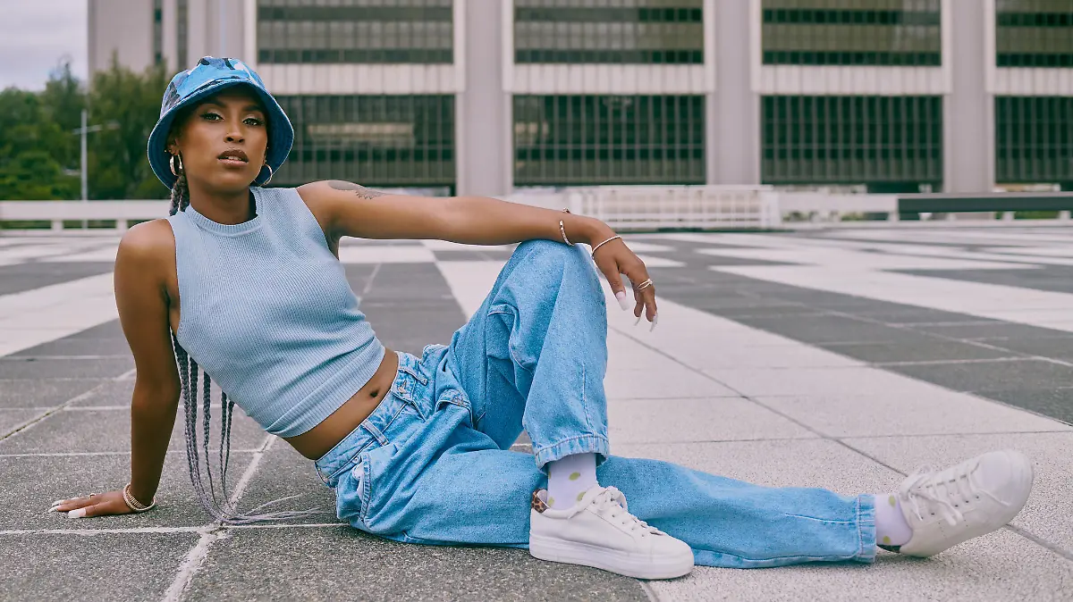Shot of a trendy young woman posing against a city background