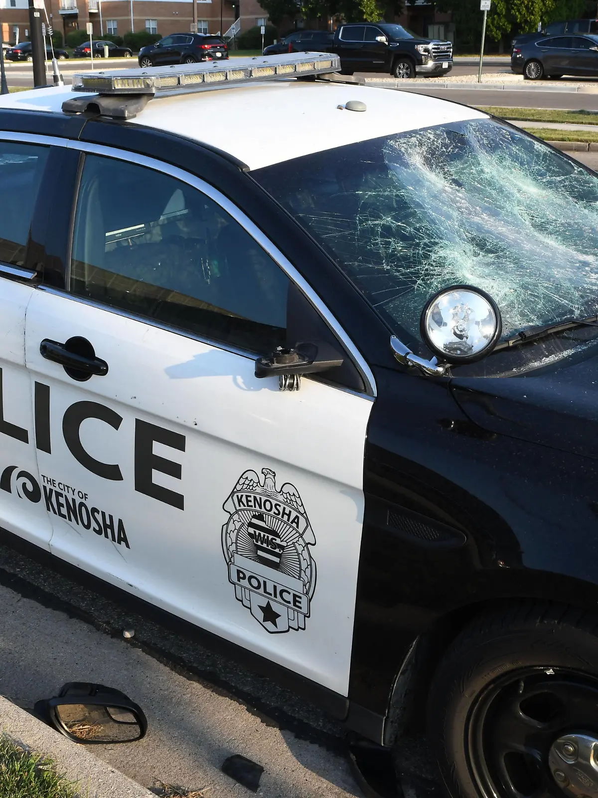 August 24, 2020, Kenosha, Wisconsin, USA: A vandalized city police car is shown outside Kenosha County Public Safety Building in downtown Kenosha, Wisconsin Monday August 24, 2020 after the shooting of Jacob Blake, an African-American man, by a white police officer the day before. Video shows the officer grabbing Blake by his t-shirt from behind as he tried to get in his car, and then shooting him seven times in the back at pointblank range. The shooting, which was condemned by Wisconsin Gov. Tony Evers, was followed by fires and looting downtown. Blake is reported Monday out of surgery and in intensive care. The museum is near the county court house which was a target of protestors. Kenosha USA - ZUMAh154 20200824_znp_h154_038 Copyright: xMarkxHertzbergx 
