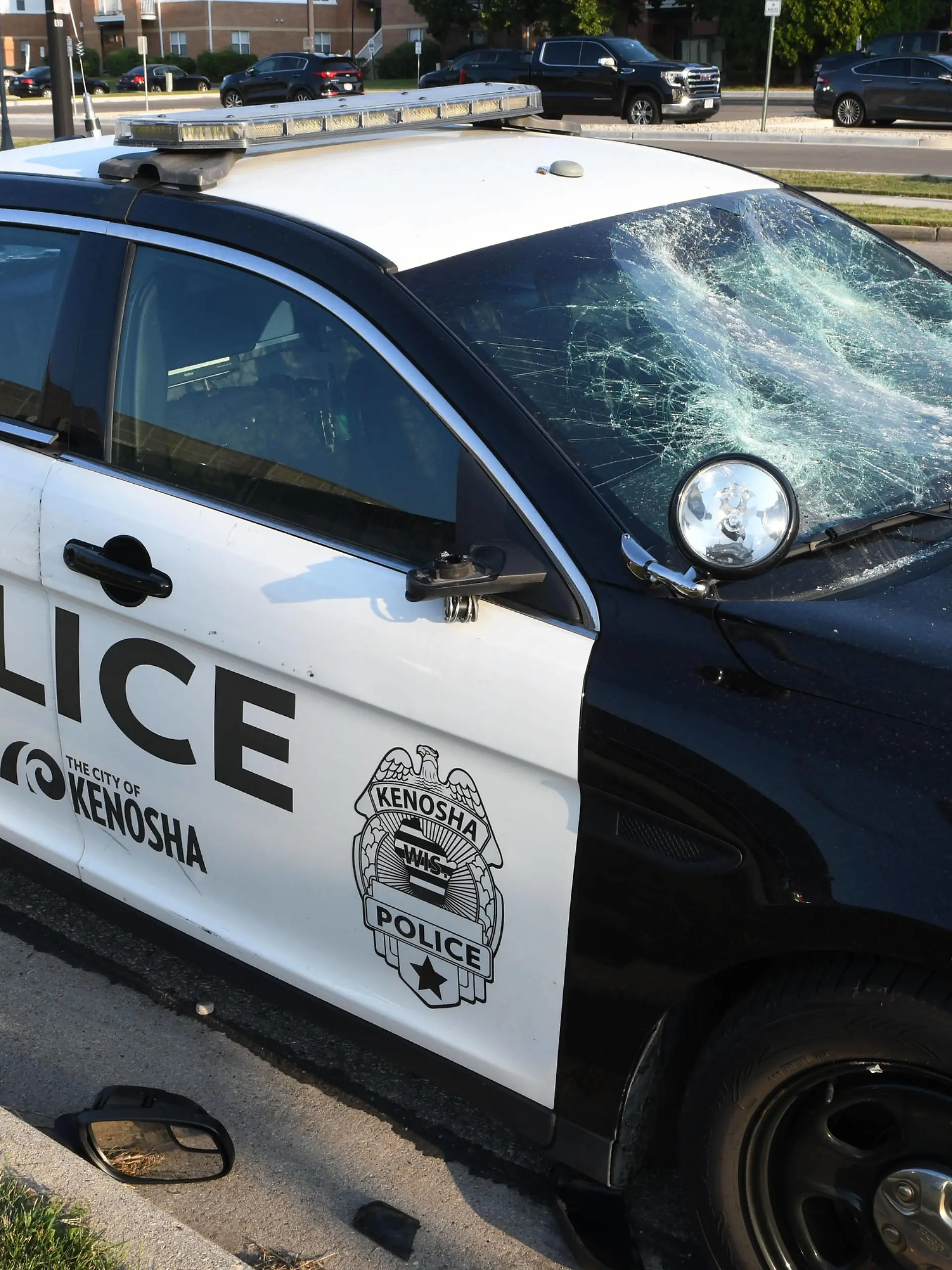 August 24, 2020, Kenosha, Wisconsin, USA: A vandalized city police car is shown outside Kenosha County Public Safety Building in downtown Kenosha, Wisconsin Monday August 24, 2020 after the shooting of Jacob Blake, an African-American man, by a white police officer the day before. Video shows the officer grabbing Blake by his t-shirt from behind as he tried to get in his car, and then shooting him seven times in the back at pointblank range. The shooting, which was condemned by Wisconsin Gov. Tony Evers, was followed by fires and looting downtown. Blake is reported Monday out of surgery and in intensive care. The museum is near the county court house which was a target of protestors. Kenosha USA - ZUMAh154 20200824_znp_h154_038 Copyright: xMarkxHertzbergx 