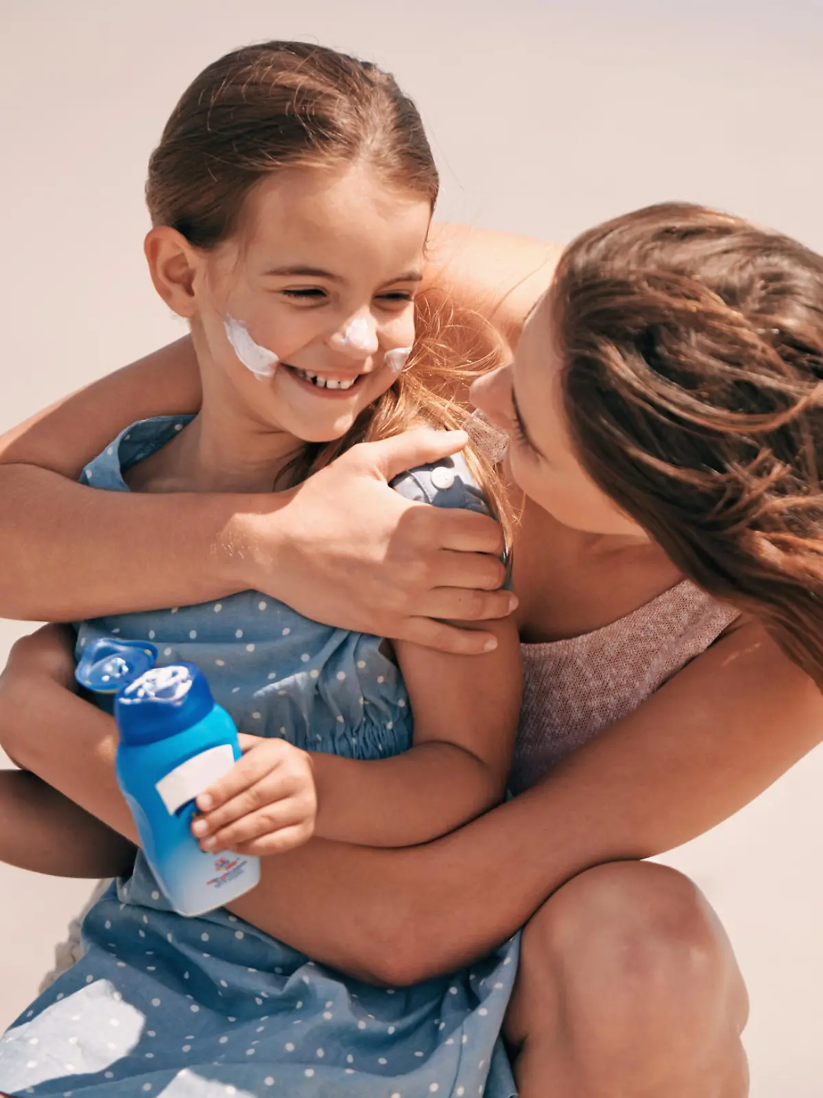 Shot of a young mother embracing her daughter at the beachhttp://195.154.178.81/DATA/shoots/ic_783222.jpg Shot of a young mother embracing her daughter at the beach