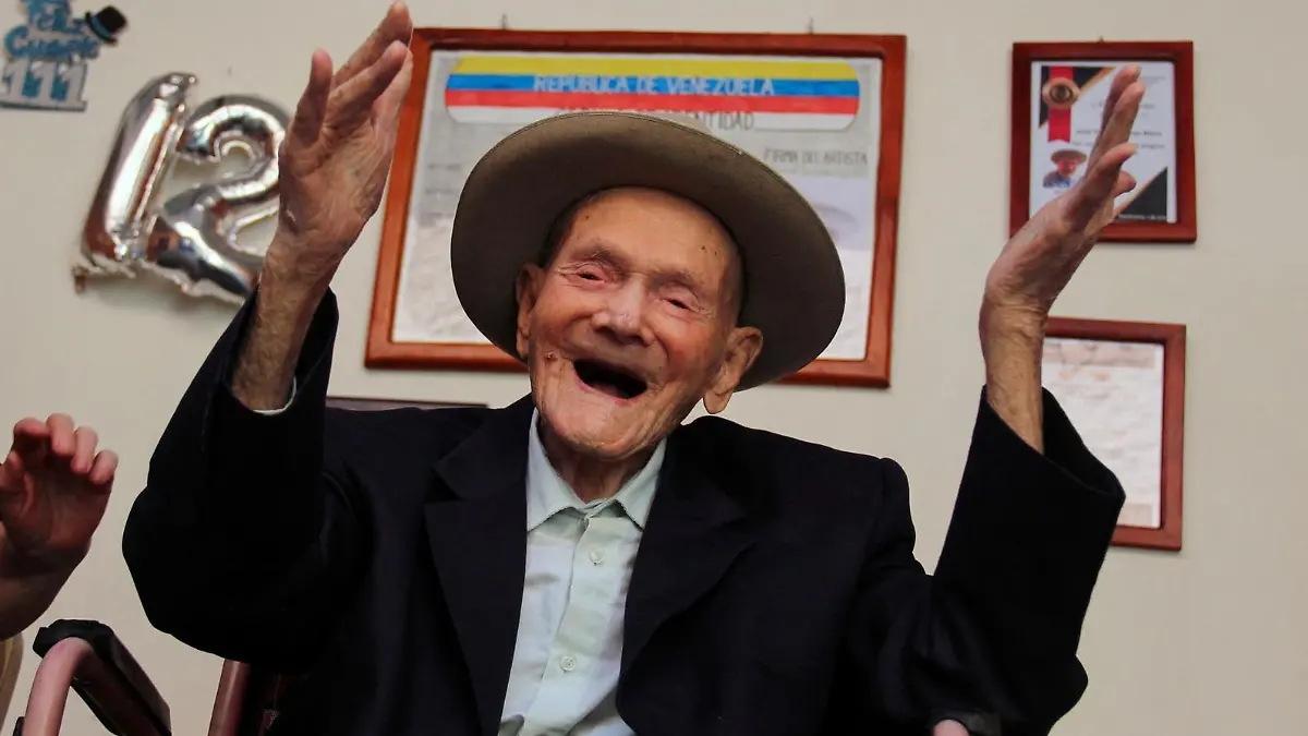 TOPSHOT - 112-year-old Venezuelan farmer Vicente Pérez gestures at his home in San Jose de Bolivar, Tachira state, Venezuela, on January 24, 2022. - Perez has been officially recognized as the oldest living man following the death of a Spaniard who was the previous holder of the title, Guinness World Records said Tuesday. (Photo by Jhonny PARRA / AFP) (Photo by JHONNY PARRA/AFP via Getty Images)