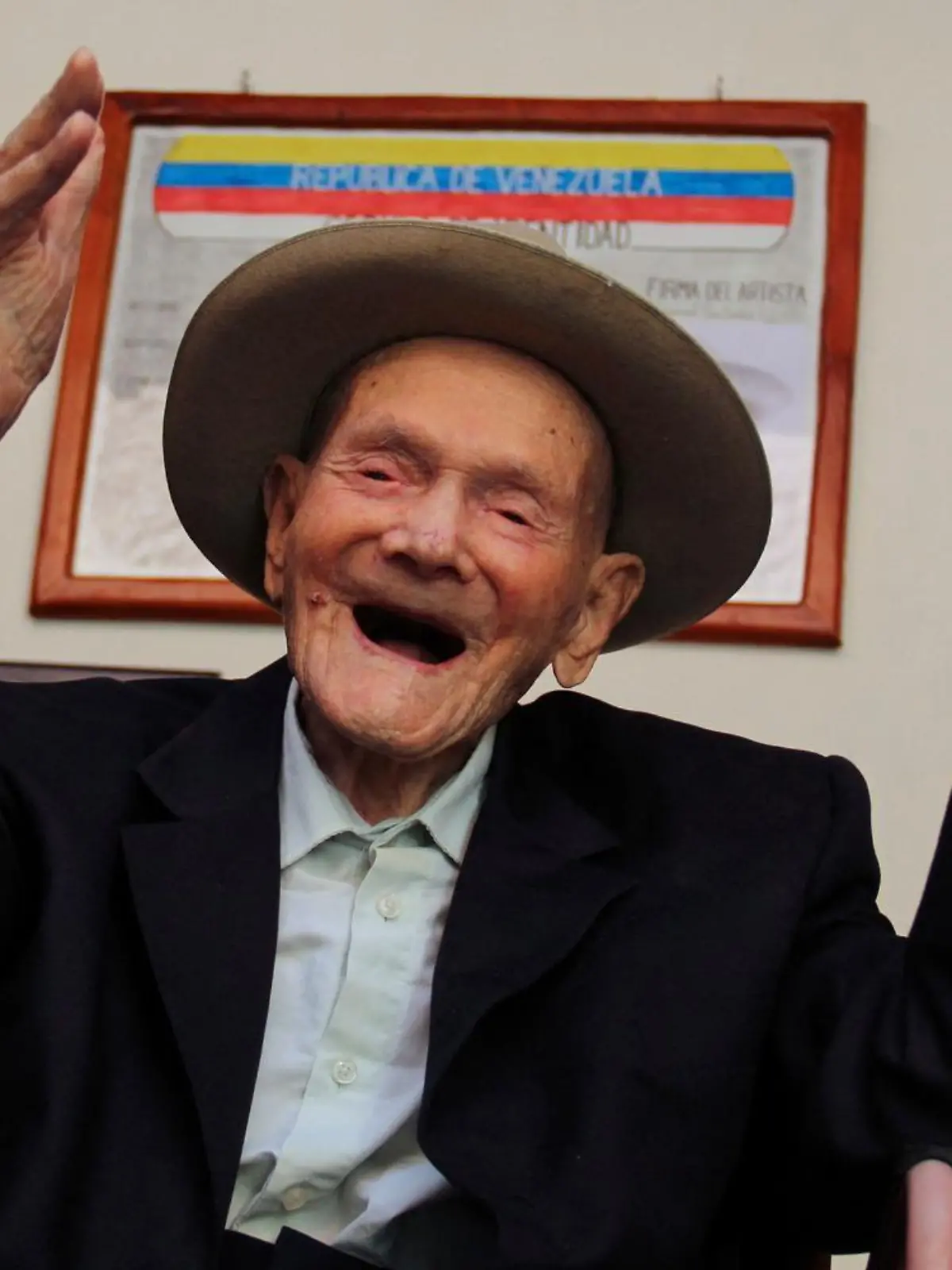 TOPSHOT - 112-year-old Venezuelan farmer Vicente Pérez gestures at his home in San Jose de Bolivar, Tachira state, Venezuela, on January 24, 2022. - Perez has been officially recognized as the oldest living man following the death of a Spaniard who was the previous holder of the title, Guinness World Records said Tuesday. (Photo by Jhonny PARRA / AFP) (Photo by JHONNY PARRA/AFP via Getty Images)