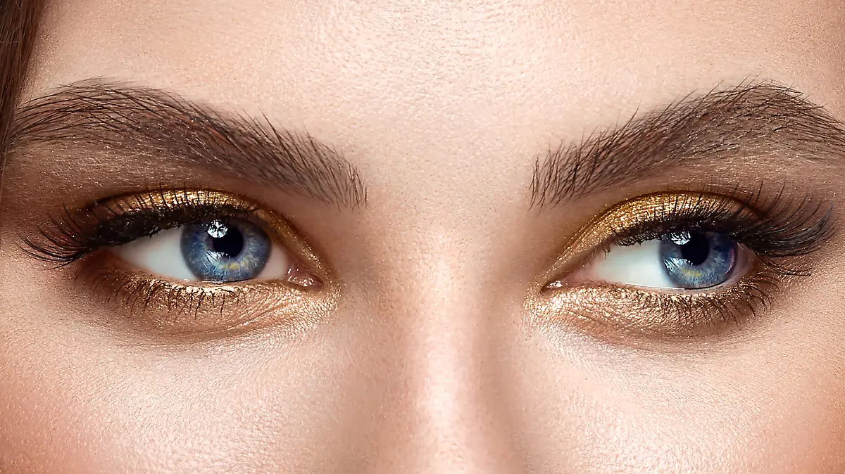 Beautiful female eyes with long eyelashes. Eyelash extensions. Makeup, cosmetics, beauty. Close up, macro