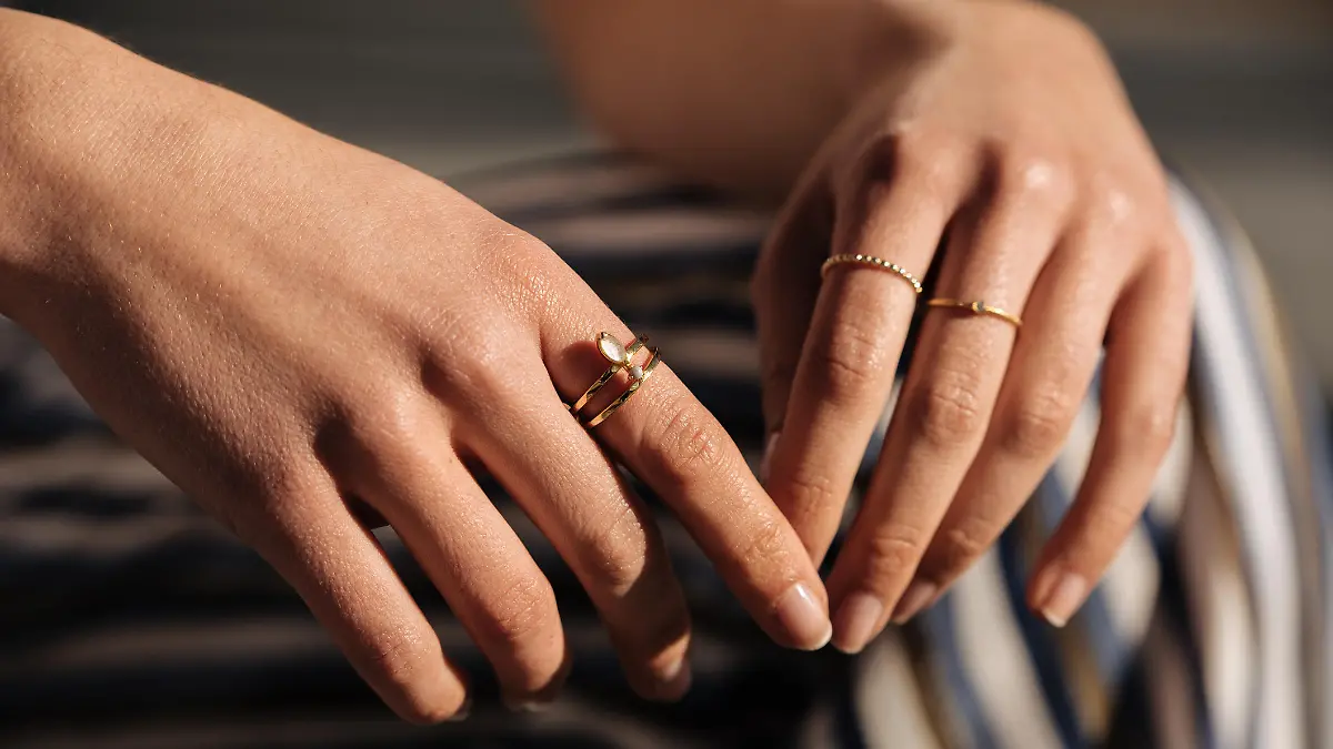 Crop woman hands with rings on the street