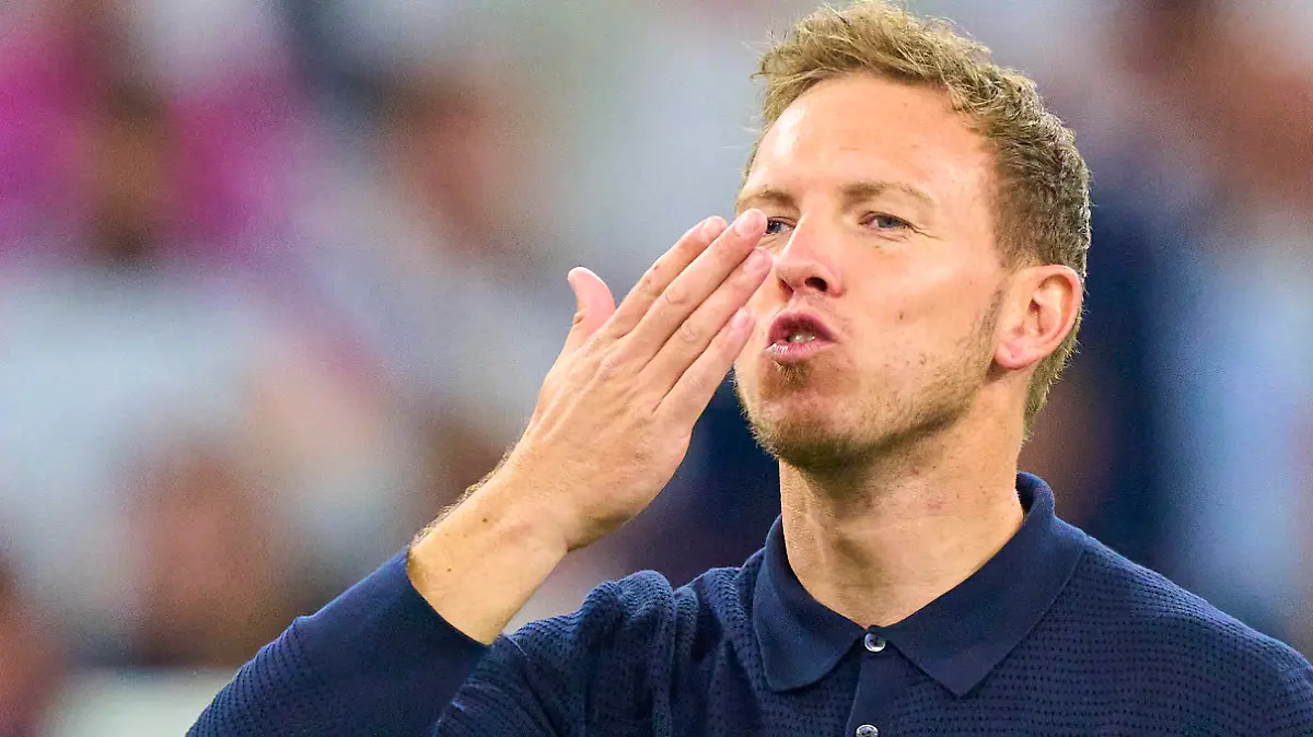 DFB headcoach Julian Nagelsmann , Bundestrainer, Nationaltrainer, celebrate, kiss Lena Wurzenberger, girlfriend of Julian Nagelsmann, coach DFB, after the group stage match GERMANY - SCOTLAND 5-1 of the UEFA European Championships 2024 on Jun 14, 2024 in Munich, Germany.
