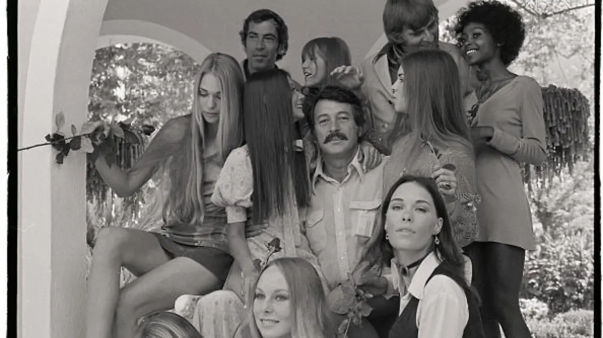 (Original Caption) BEL AIR, CA: Rock Hudson is surrounded by a bevy of so-far unknown girls who will be in MGM's "Pretty Maids All in a Row, " starring Hudson. It is the first feature film to be produced by Gene Roddenberry (top right), the first to be directed in the United States by Roger Vadim (top left) and also marks the first time Hudson will appear in a black comedy.