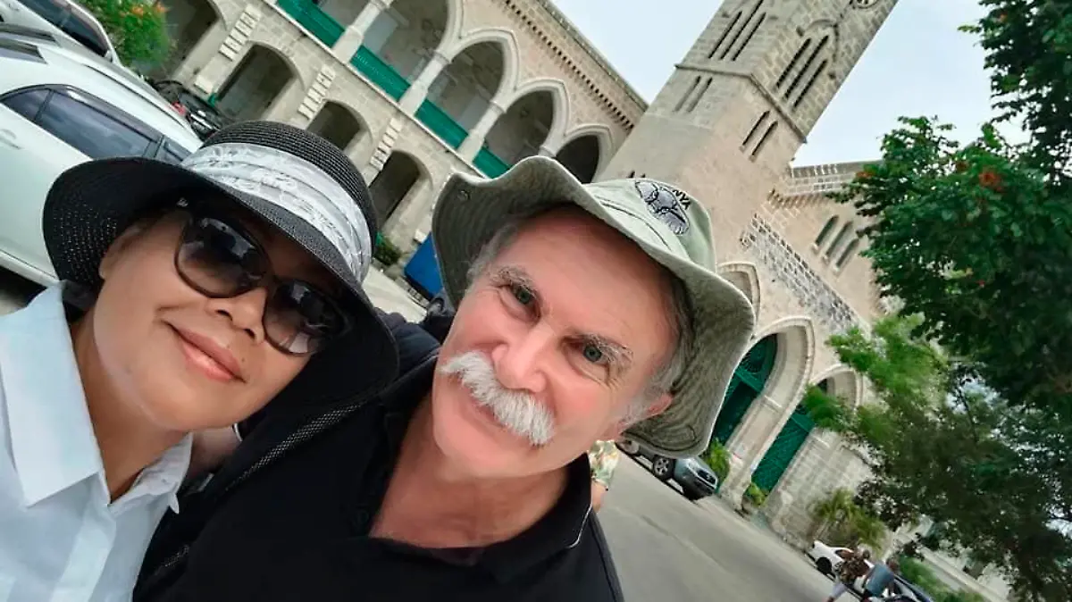FILE - This undated photo provided by the Fitton family shows Jim Fiitton with his wife Sarijah. Fitton, a British national accused by Iraq of collecting small archaeological fragments will be tried on Sunday on charges potentially punishable by death, his Baghdad lawyer said Wednesday, May 11, 2022. (Fitton family via AP, File )