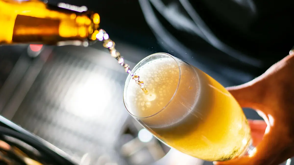 bartender pouring beer to the glass