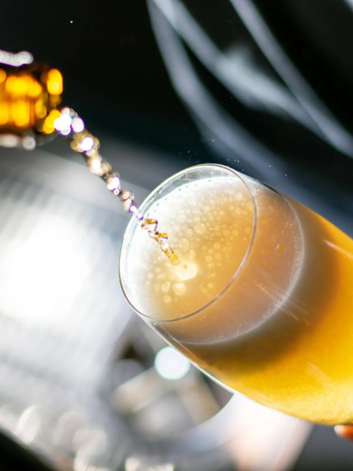 bartender pouring beer to the glass