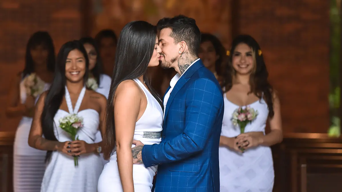 Story from Jam Press (Multi Wives Kids)

Pictured: Arthur O Urso during his wedding ceremony to his 9 wives.

Man with EIGHT wives now plans to have KIDS and says it's 'first come, first served' – as one partner LEAVES the marriage

A man with eight wives has revealed he's now planning to have kids but says it's 'first come, first served' on who will be the mother – as one of his partners ditches the marriage for good.

Arthur O Urso, from Brazil, hit the headlines last month after revealing that he was forced to keep a sex rota to keep his nine partners satisfied, with one wife now having permanently left the fold.

The model and his first wife, Luana Kazaki, are swingers and formalised their union with the other women at a Catholic church in São Paulo – although it is not legally binding as polygamy is illegal in the country.

Now, Arthur and his wives, who "celebrate free love", have decided to expand their family – with a baby.

Having rid himself of the sex schedule last month, the model isn't fussed which of his wives will be the first to conceive with him.

"The cool thing about all this is that regardless of which of my wives has the baby, the child will grow up with a lot of love and affection from everyone," Arthur told Jam Press.

"I don't have a favourite wife for this to happen, we're letting it happen naturally."

The group have discussed the future and some of the women are not yet keen for motherhood, while others are feeling broody and are thrilled for a mini-them to join the family.

Arthur said: "I can't hide that I'm very anxious, they are all keen for it.

"I believe that after the first child comes and the others see the whole situation, they will definitely want to feel and experience the same.

"But for now, it's first come, first served."

Arthur has over 100,000 followers on Instagram, where he regularly shares tidbits of his life with his wives including photos of them snuggled up in bed together or on outings as a group.

He has 