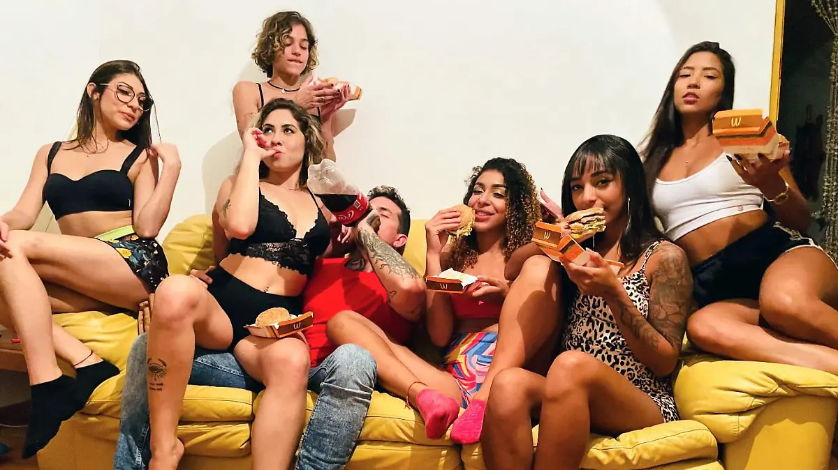 Story from Jam Press (Multi Wives Kids)

Pictured: Arthur O Urso with some of his wives.

Man with EIGHT wives now plans to have KIDS and says it's 'first come, first served' – as one partner LEAVES the marriage

A man with eight wives has revealed he's now planning to have kids but says it's 'first come, first served' on who will be the mother – as one of his partners ditches the marriage for good.

Arthur O Urso, from Brazil, hit the headlines last month after revealing that he was forced to keep a sex rota to keep his nine partners satisfied, with one wife now having permanently left the fold.

The model and his first wife, Luana Kazaki, are swingers and formalised their union with the other women at a Catholic church in São Paulo – although it is not legally binding as polygamy is illegal in the country.

Now, Arthur and his wives, who "celebrate free love", have decided to expand their family – with a baby.

Having rid himself of the sex schedule last month, the model isn't fussed which of his wives will be the first to conceive with him.

"The cool thing about all this is that regardless of which of my wives has the baby, the child will grow up with a lot of love and affection from everyone," Arthur told Jam Press.

"I don't have a favourite wife for this to happen, we're letting it happen naturally."

The group have discussed the future and some of the women are not yet keen for motherhood, while others are feeling broody and are thrilled for a mini-them to join the family.

Arthur said: "I can't hide that I'm very anxious, they are all keen for it.

"I believe that after the first child comes and the others see the whole situation, they will definitely want to feel and experience the same.

"But for now, it's first come, first served."

Arthur has over 100,000 followers on Instagram, where he regularly shares tidbits of his life with his wives including photos of them snuggled up in bed together or on outings as a group.

He has previously spoken ab