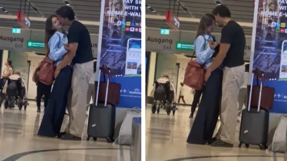 Stefanie Giesinger und Armando Mayr turtelnd am Berliner Flughafen.