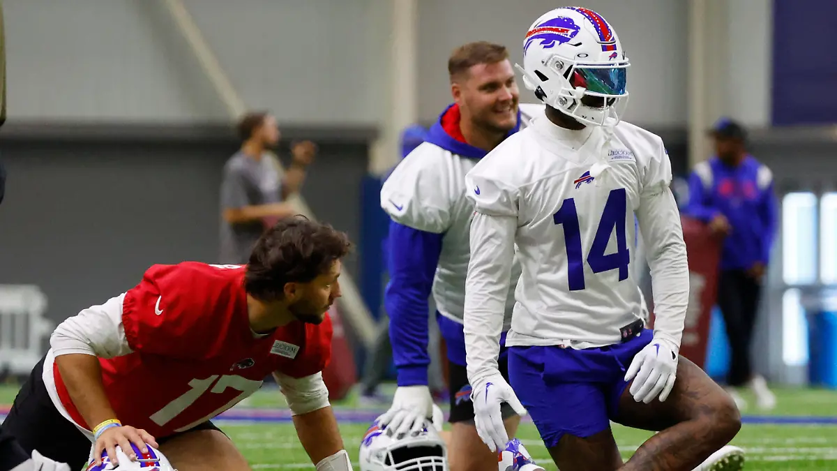 Buffalo Bills quarterback Josh Allen (17) and wide receiver Stefon Diggs (14) stretch during NFL football practice in Orchard Park, N.Y., Wednesday June 14, 2023. (AP Photo/Jeffrey T. Barnes)