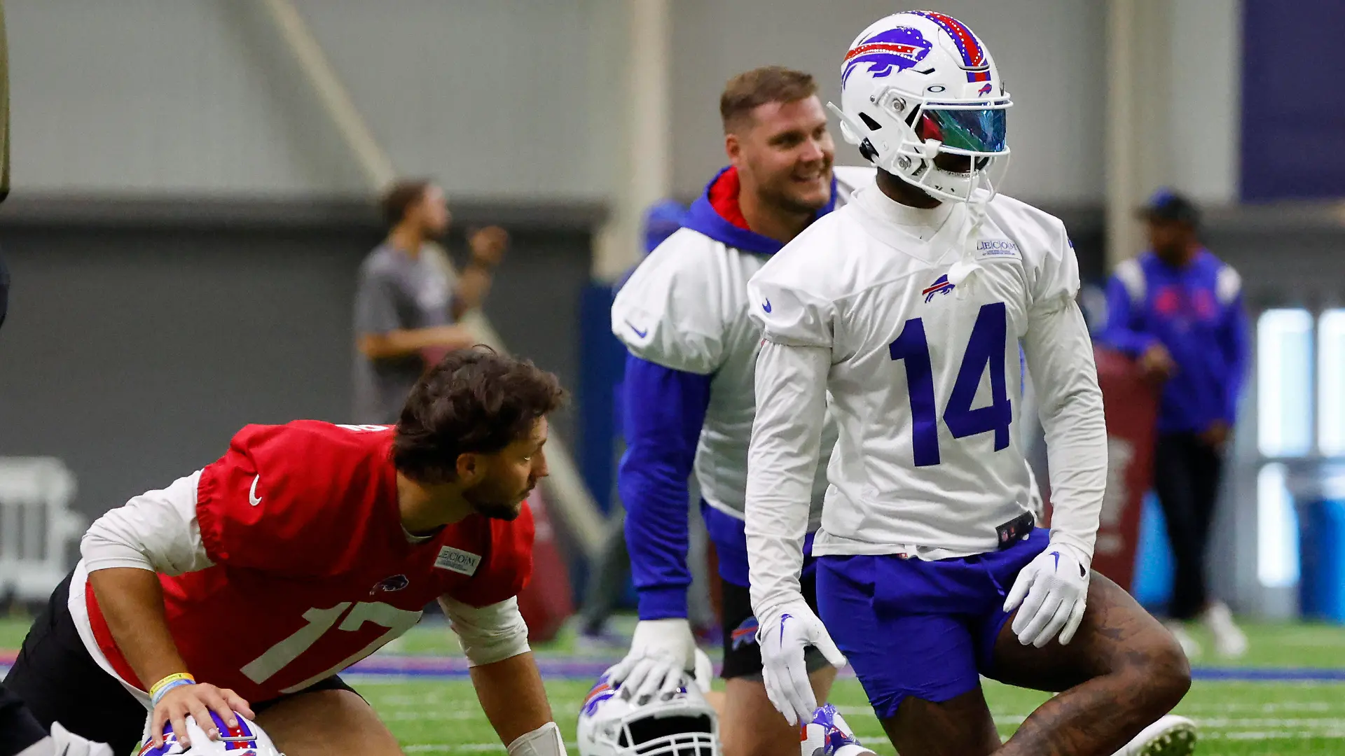 Buffalo Bills quarterback Josh Allen (17) and wide receiver Stefon Diggs (14) stretch during NFL football practice in Orchard Park, N.Y., Wednesday June 14, 2023. (AP Photo/Jeffrey T. Barnes)