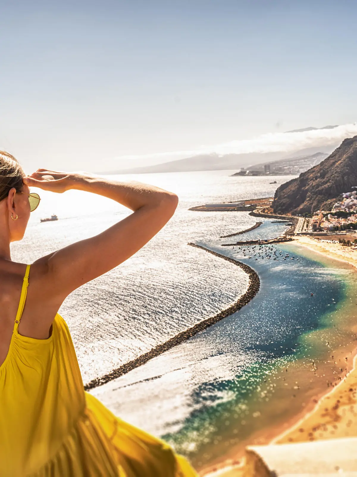 Amazing place to visit. Woman looking at the landscape of Las Teresitas beach and San Andres village, Tenerife, Canary Islands, Spain. Tourism. Vacation. Travel.