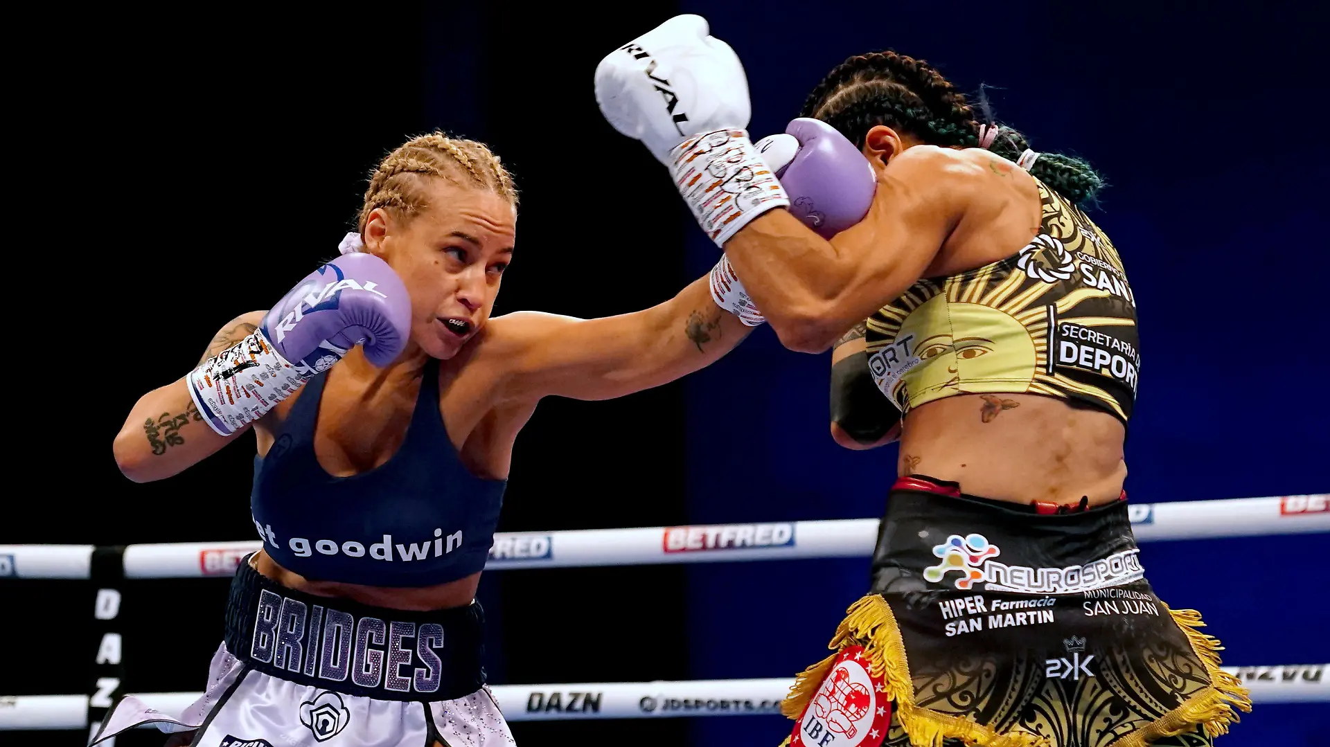 Kiko Martinez v Josh Warrington - First Direct Arena. Ebanie Bridges (left) in action against Maria Cecilia Roman during their IBF World Bantamweight Title fight at the First Direct Arena, Leeds. Picture date: Saturday March 26, 2022. See PA story BOXING Leeds. Photo credit should read: Martin Rickett/PA Wire. RESTRICTIONS: Use subject to restrictions. Editorial use only, no commercial use without prior consent from rights holder. URN:66072276