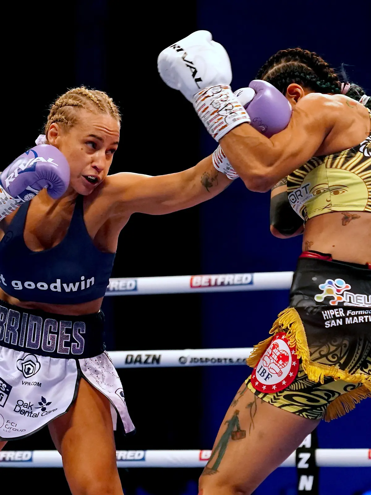 Kiko Martinez v Josh Warrington - First Direct Arena. Ebanie Bridges (left) in action against Maria Cecilia Roman during their IBF World Bantamweight Title fight at the First Direct Arena, Leeds. Picture date: Saturday March 26, 2022. See PA story BOXING Leeds. Photo credit should read: Martin Rickett/PA Wire. RESTRICTIONS: Use subject to restrictions. Editorial use only, no commercial use without prior consent from rights holder. URN:66072276