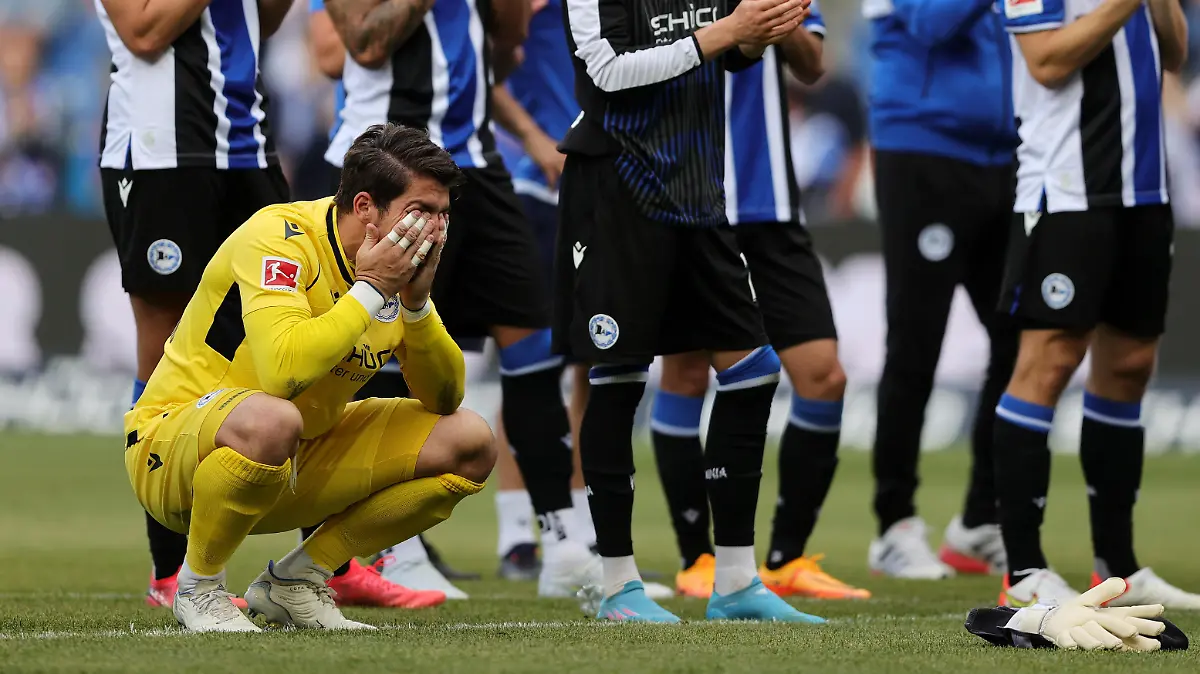 BIELEFELD, GERMANY - MAY 14: Stefan Ortega of Arminia Bielefeld reacts as the team applaud the fans following the Bundesliga match between DSC Arminia Bielefeld and RB Leipzig at Schueco Arena on May 14, 2022 in Bielefeld, Germany. (Photo by Joosep Martinson/Getty Images)