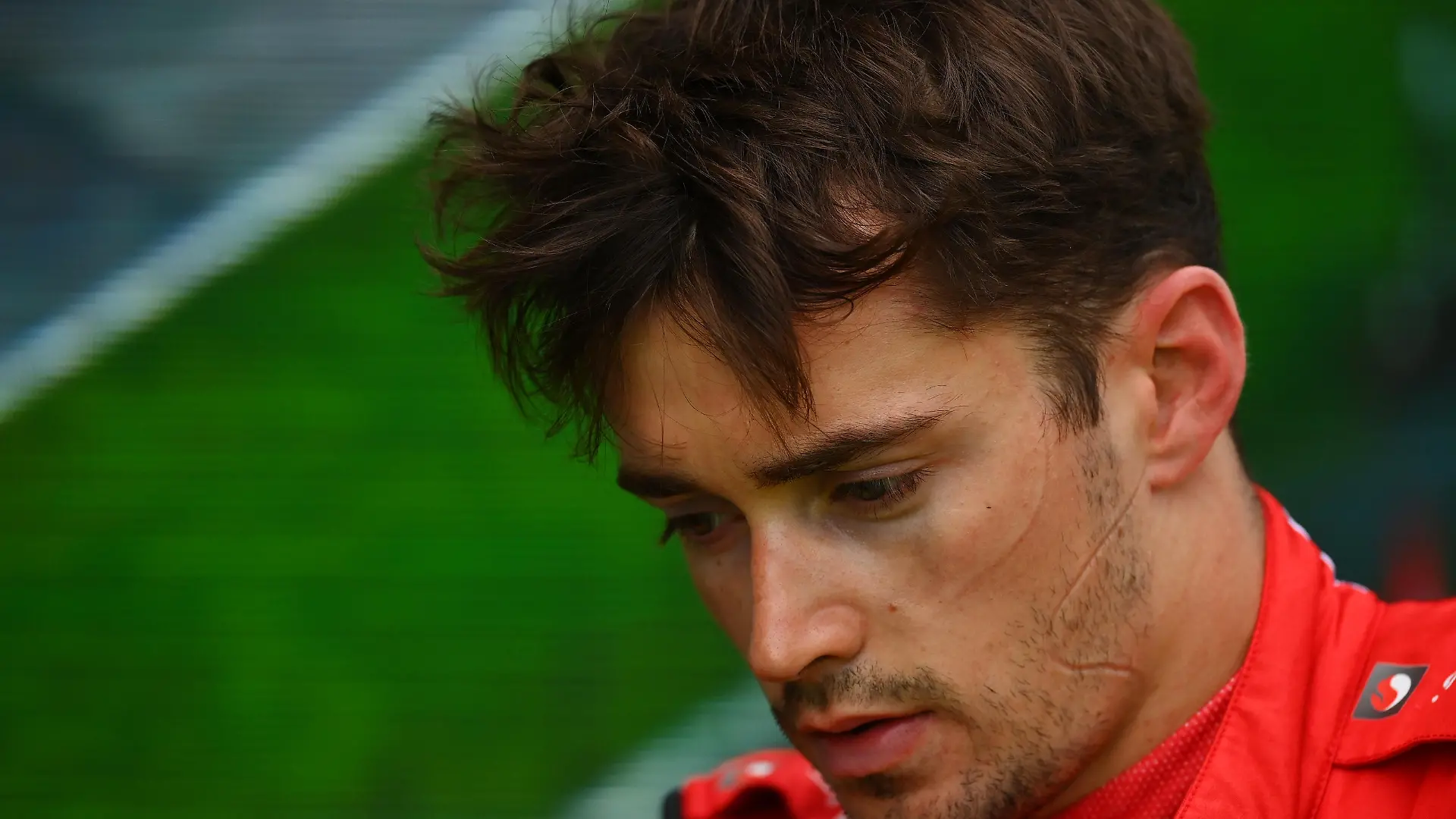 IMOLA, ITALY - APRIL 24: 6th placed Charles Leclerc of Monaco and Ferrari looks dejected in parc ferme after spinning out from third position with 10 laps remaining during the F1 Grand Prix of Emilia Romagna at Autodromo Enzo e Dino Ferrari on April 24, 2022 in Imola, Italy. (Photo by Dan Mullan/Getty Images)