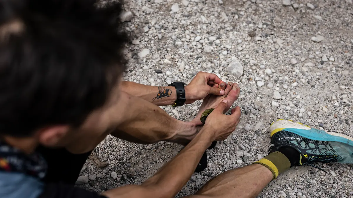 Michael Strasser finishes his project 771 at Triglav in Slovenia, on July 9 2024, analyzing his frozen toes 