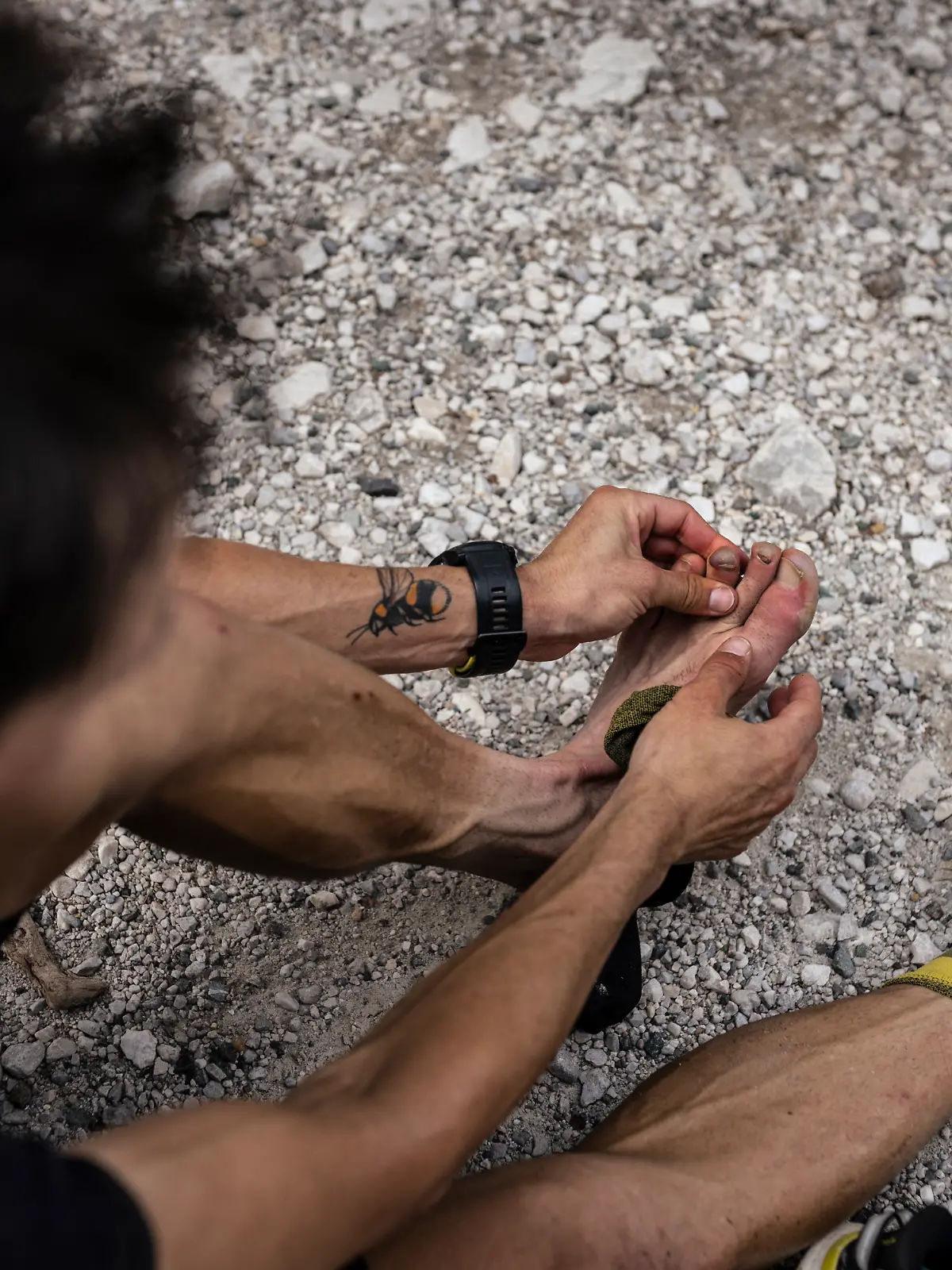 Michael Strasser finishes his project 771 at Triglav in Slovenia, on July 9 2024, analyzing his frozen toes 