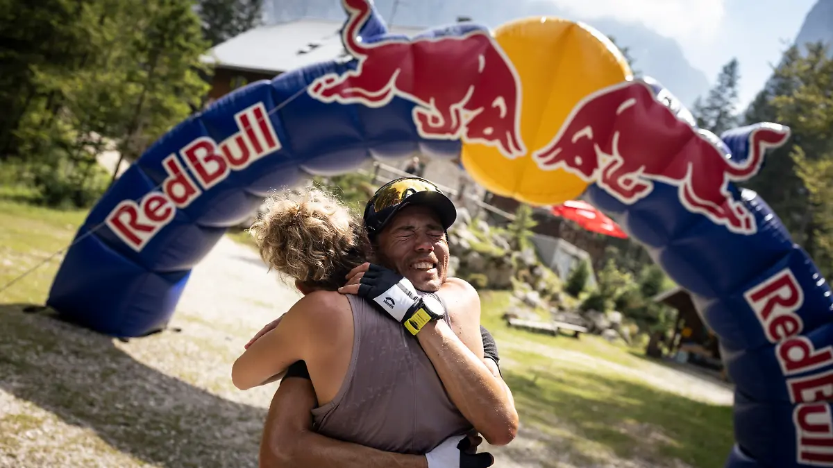Michael Strasser finishes his project 771 at Triglav in Slovenia, on July 9 2024, emotionally hugging his wife
