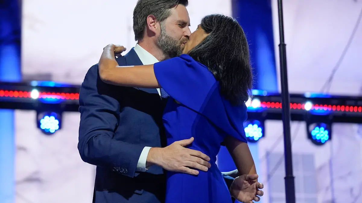 Republican vice presidential candidate Sen. JD Vance, R-Ohio, kisses his wife Usha Chilukuri Vance after speaking at the third day of the Republican National Convention at the Fiserv Forum, Wednesday, July 17, 2024, in Milwaukee. (AP Photo/Evan Vucci)