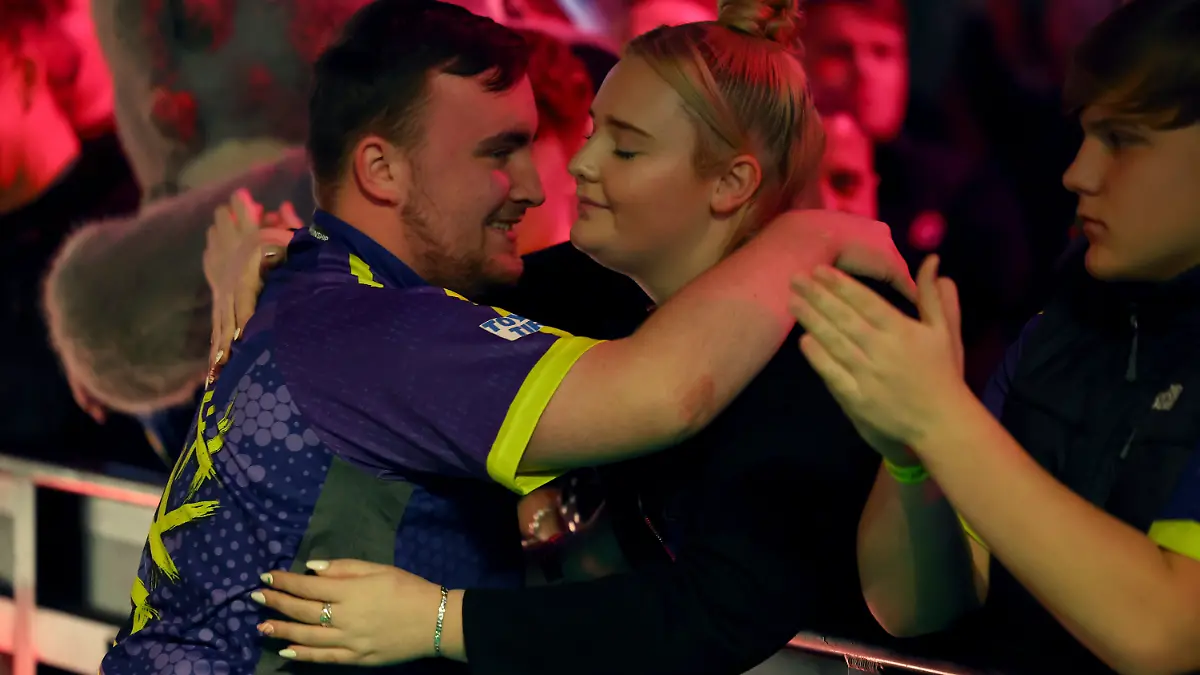 2nd January 2024, Alexandra Palace, London, England; 2023/24 PDC Paddy Power World Darts Championships Day 15, Semi Finals; Luke Littler hugs his girlfriend Eloise Milburn before his match with Rob Cross