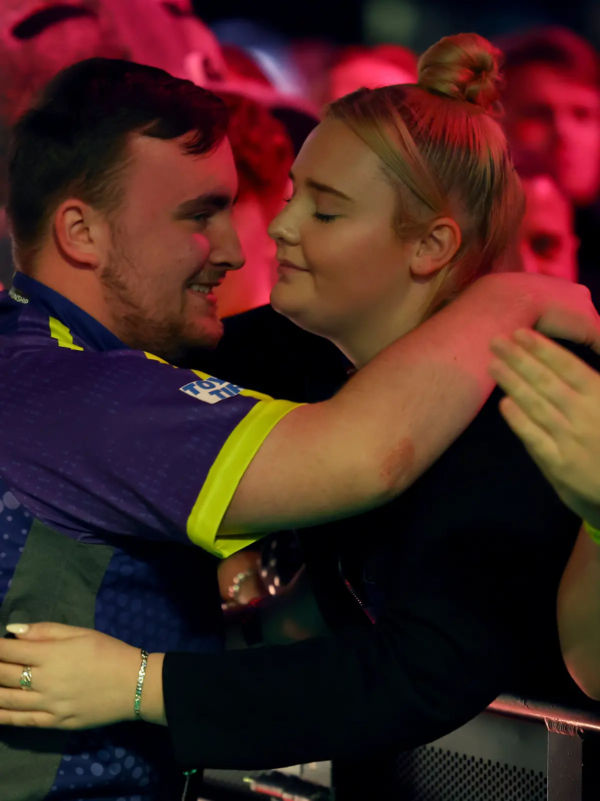 2nd January 2024, Alexandra Palace, London, England; 2023/24 PDC Paddy Power World Darts Championships Day 15, Semi Finals; Luke Littler hugs his girlfriend Eloise Milburn before his match with Rob Cross