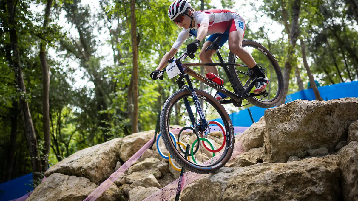 French biker Loana Lecomte trains on the course of the Olympic MTB Cross-Country mountain bike race to be held in Elancourt on July 28-29, 2024.