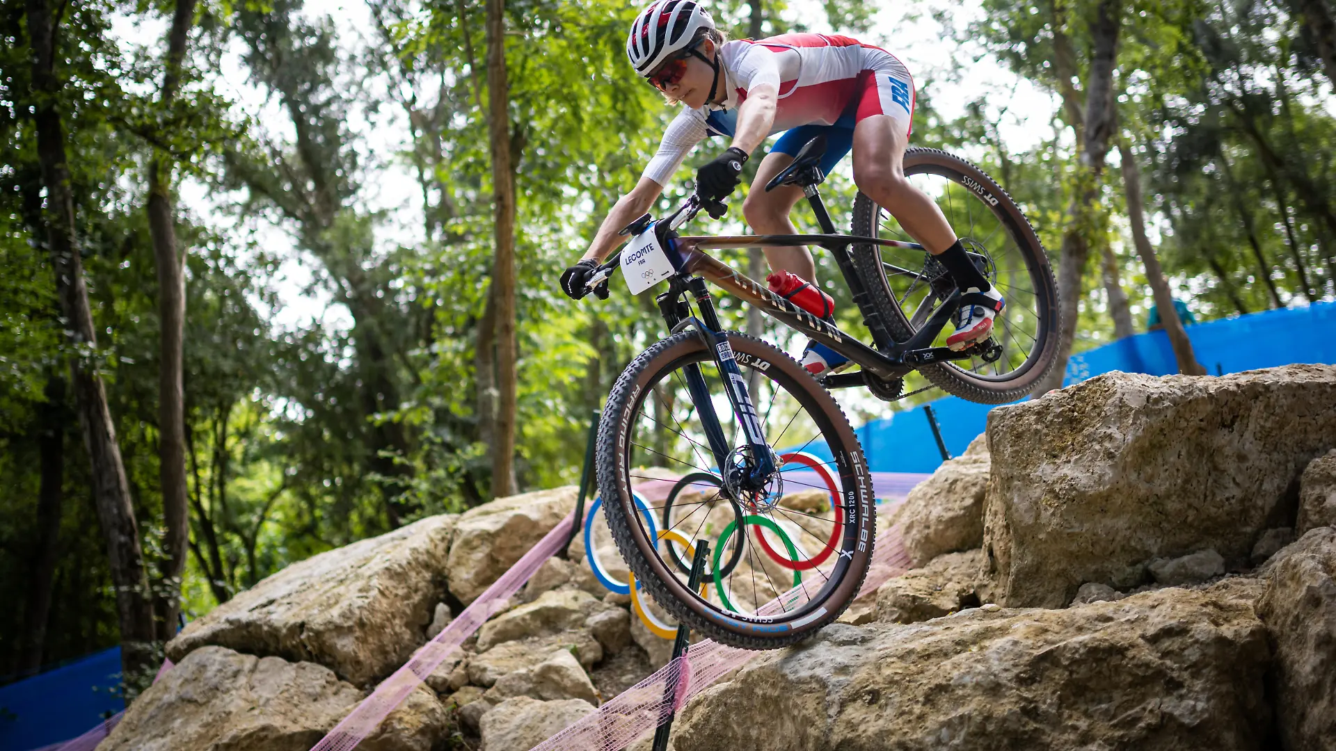 French biker Loana Lecomte trains on the course of the Olympic MTB Cross-Country mountain bike race to be held in Elancourt on July 28-29, 2024.