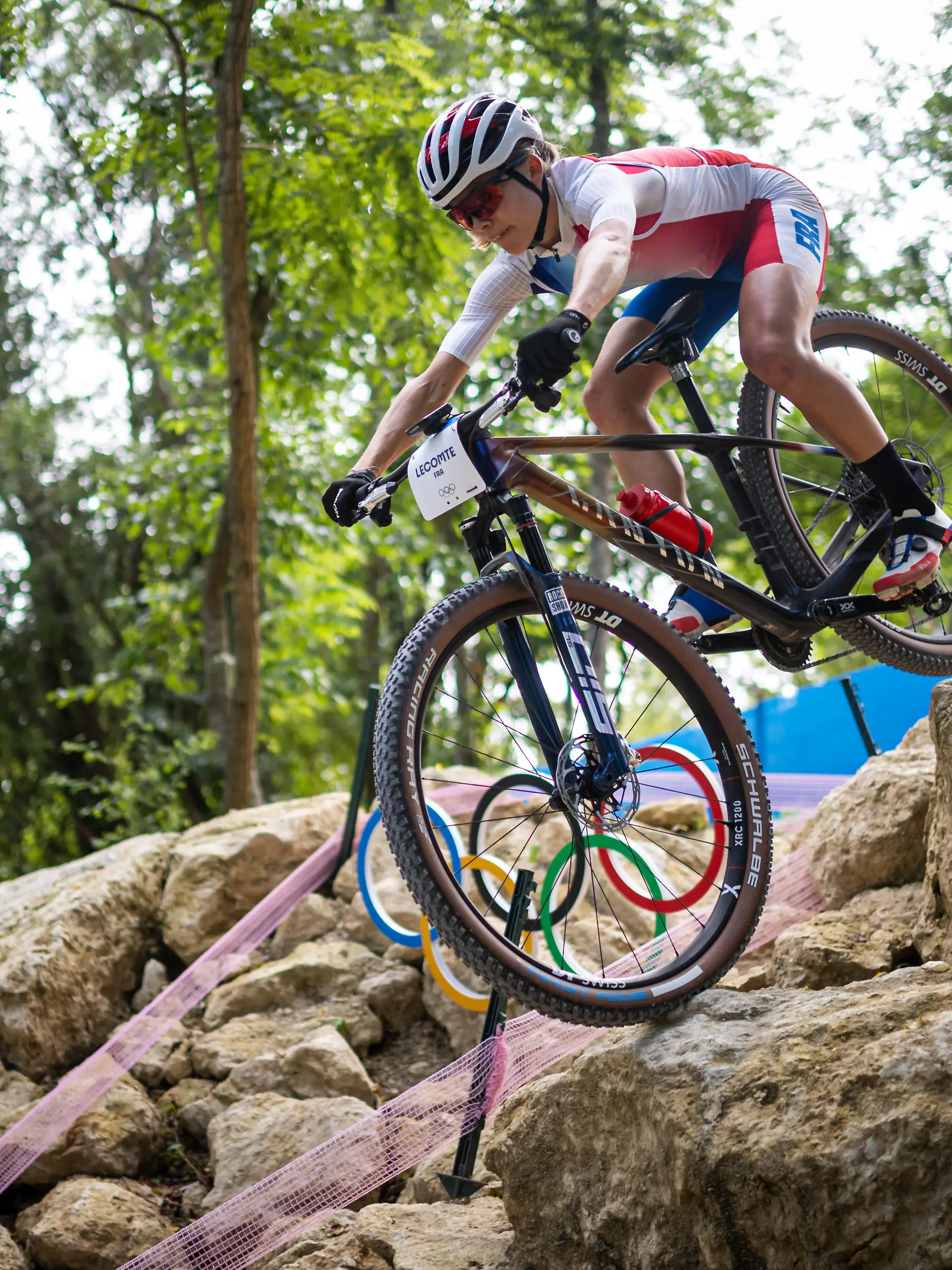 French biker Loana Lecomte trains on the course of the Olympic MTB Cross-Country mountain bike race to be held in Elancourt on July 28-29, 2024.