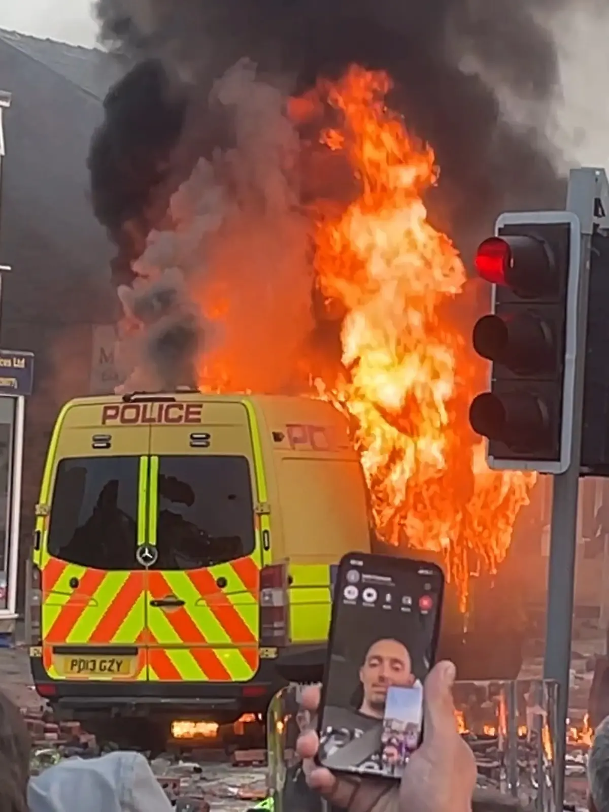 Southport incident. A police van set alight as trouble flares during a protest in Southport, after three children died and eight were injured in a „ferocious” knife attack during a Taylor Swift event at a dance school on Monday. A 17-year-old male from Banks, Lancashire, has been arrested on suspicion of murder and attempted murder over the incident. Picture date: Wednesday July 31, 2024. See PA story POLICE Southport. Photo credit should read: Richard McCarthy/PA Wire URN:77004999