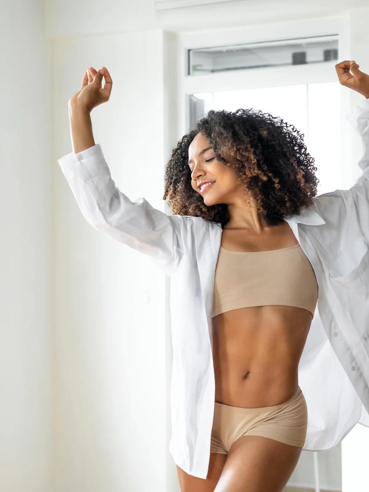 Woman  dancing in living room at home