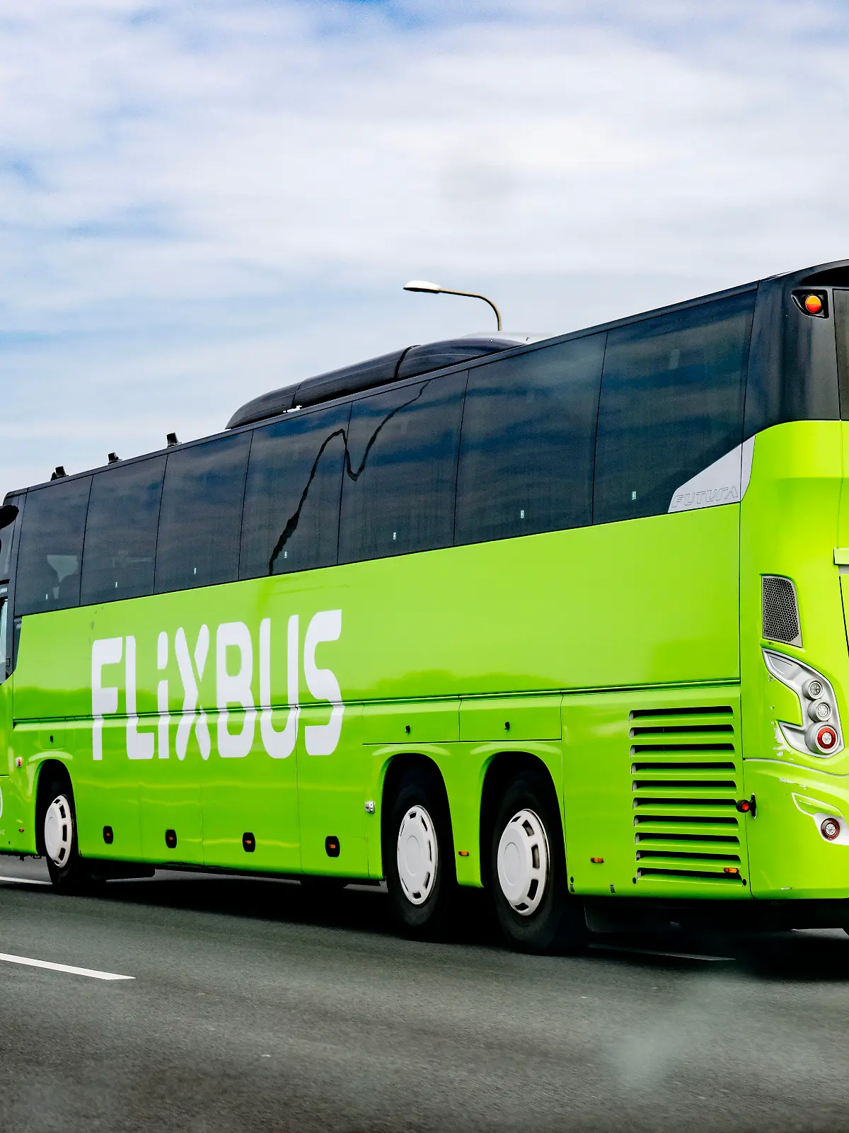 A4 - A flixbus en route with travelers on the highway. FlixBus is the trademark for the intercity buses of the German holding company FlixMobility, which is active in 16 countries, mainly in Western Europe. In 2015, FlixBus carried 20 million passengers, in 2018 this had increased to 95 million passengers. Robin Utrecht