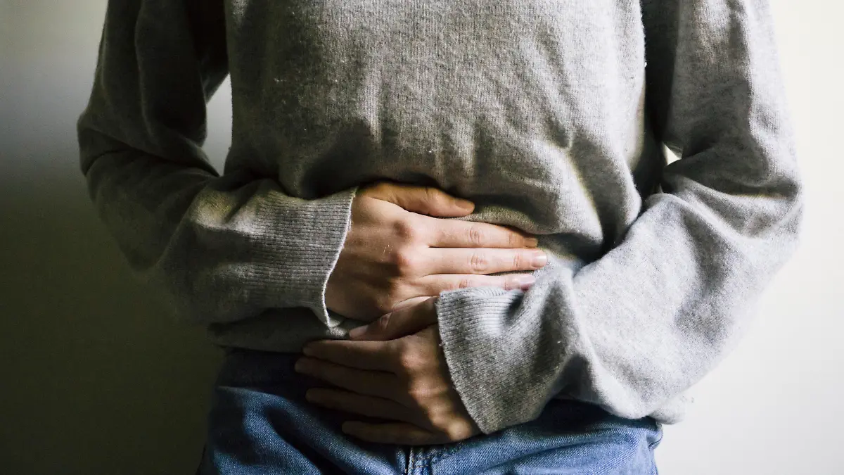 Woman suffering from stomach ache