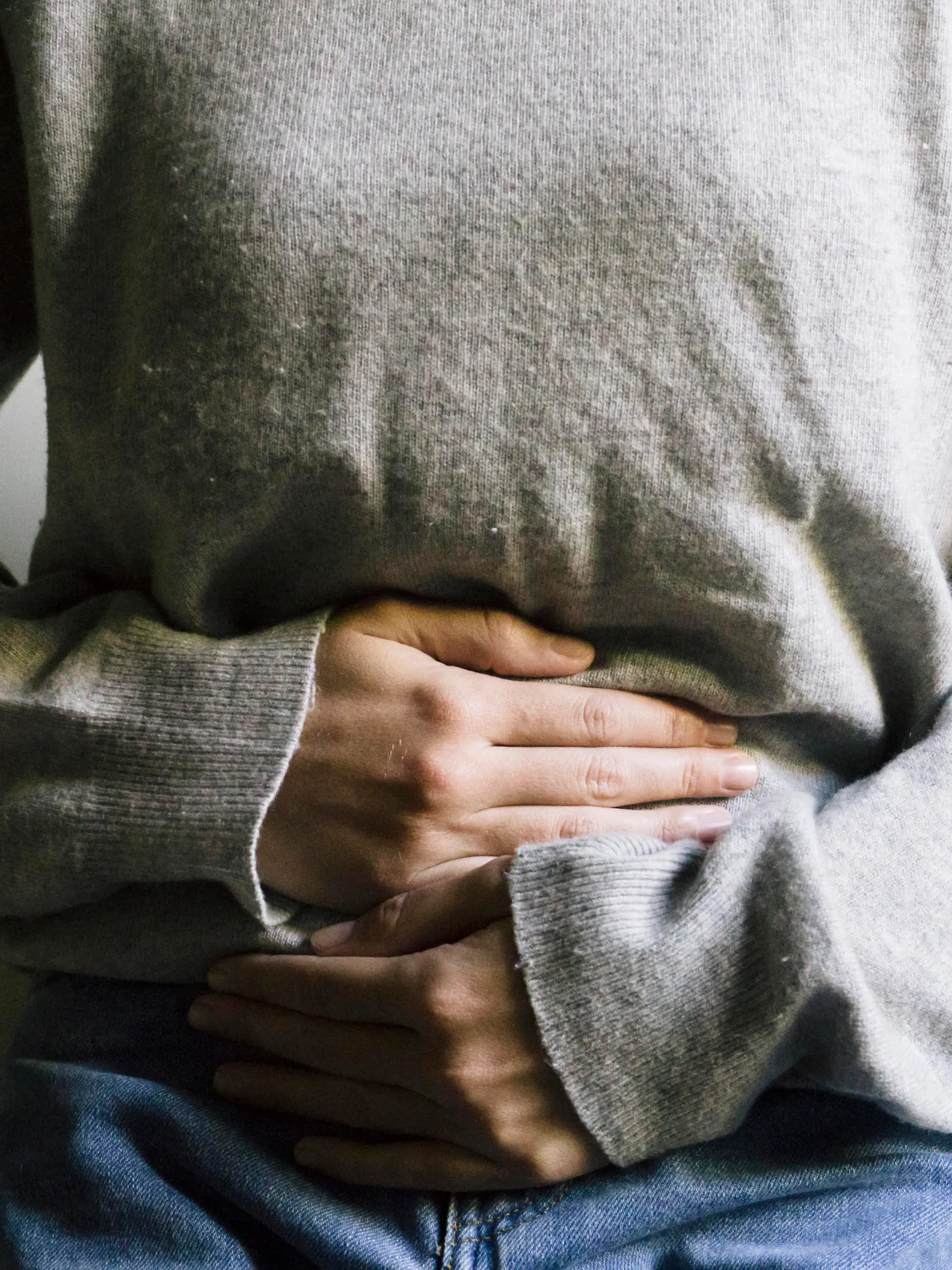 Woman suffering from stomach ache