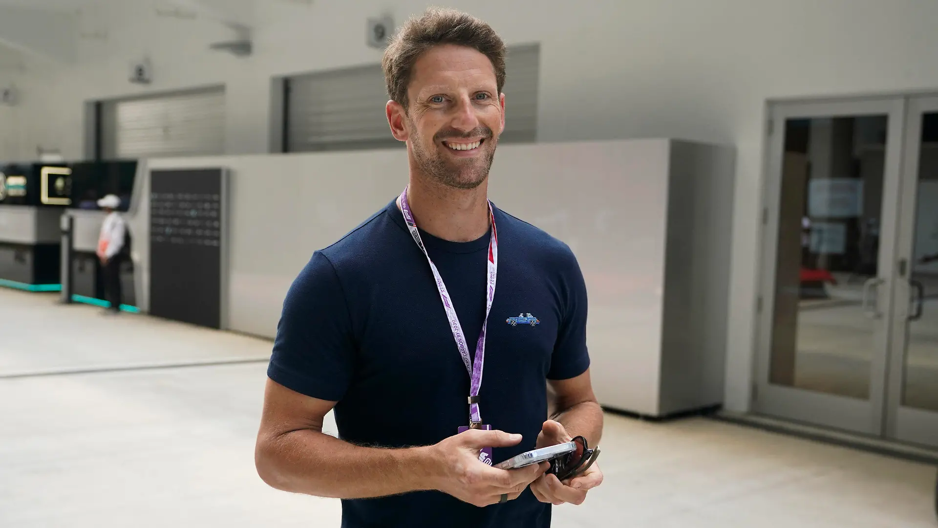 Former Formula One driver Romain Grosjean arrives at Miami International Autodrome for the Formula One Miami Grand Prix auto race, Thursday, May 5, 2022, in Miami Gardens, Fla. (AP Photo/Darron Cummings)