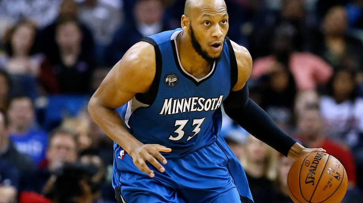 FILE - Minnesota Timberwolves forward Adreian Payne (33) drives with the ball during the second half of an NBA basketball game, Feb. 27, 2016, in New Orleans. Former Michigan State basketball standout and NBA player Adreian Payne has died. He was 31. The Orange County Sheriff’s Office said deputies responded to a shooting Monday, May 9, 2022 when Payne was identified and taken to a hospital where he was pronounced dead. (AP Photo/Jonathan Bachman)