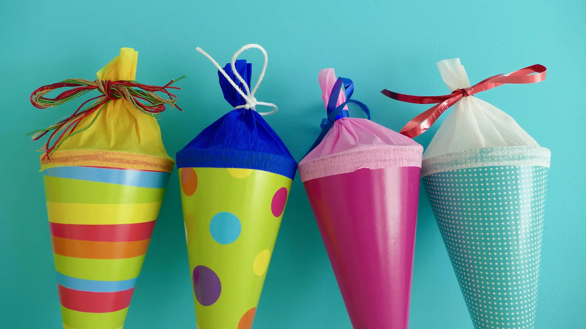 Four multi colored conical bag of sweets
