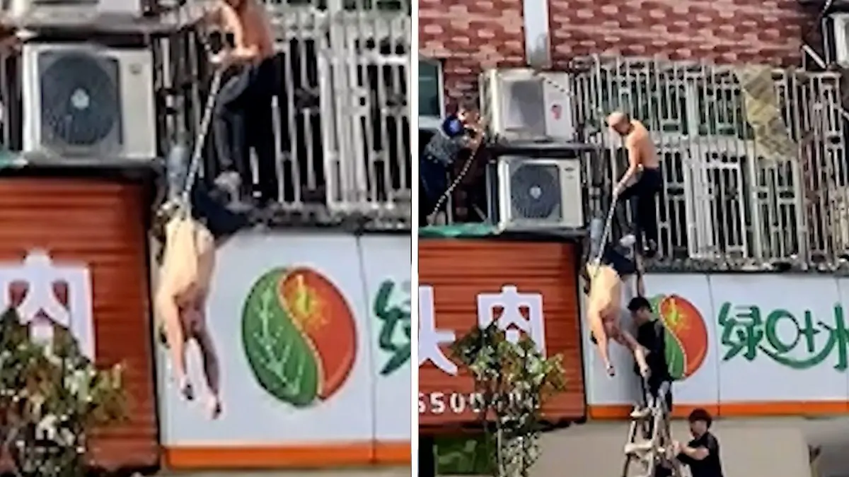 Mann hängt kopfüber und bewusstlos über Straße Aus dem Fenster ins Unglück