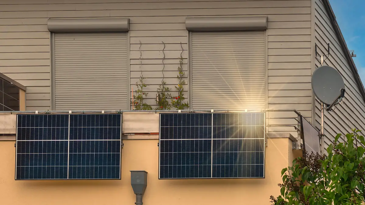 Balcony solar power station eco-friendly to use renewable energy. Solar power plant on a balcony with sunlight reflection and special lens flare light effect.