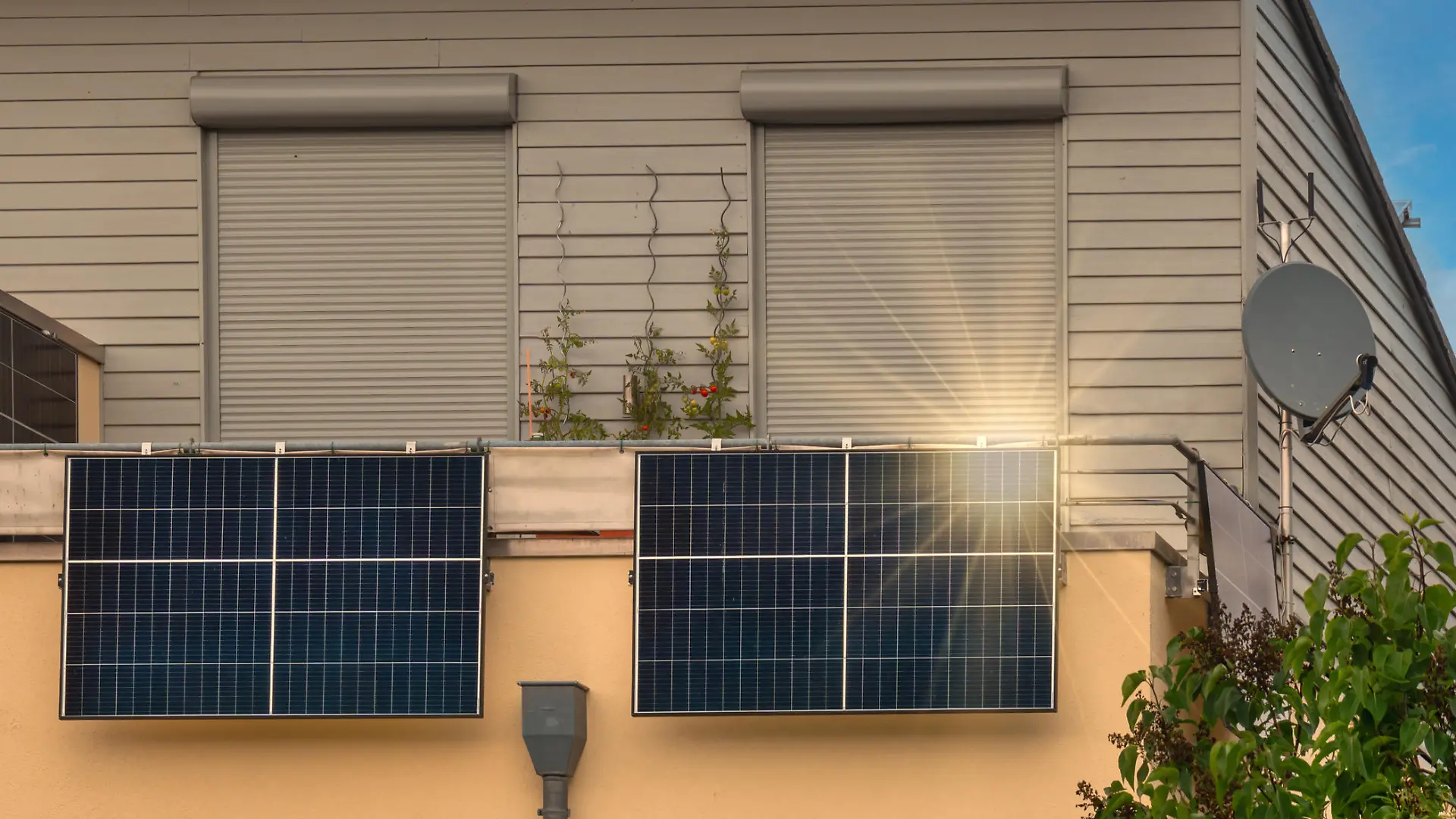 Balcony solar power station eco-friendly to use renewable energy. Solar power plant on a balcony with sunlight reflection and special lens flare light effect.