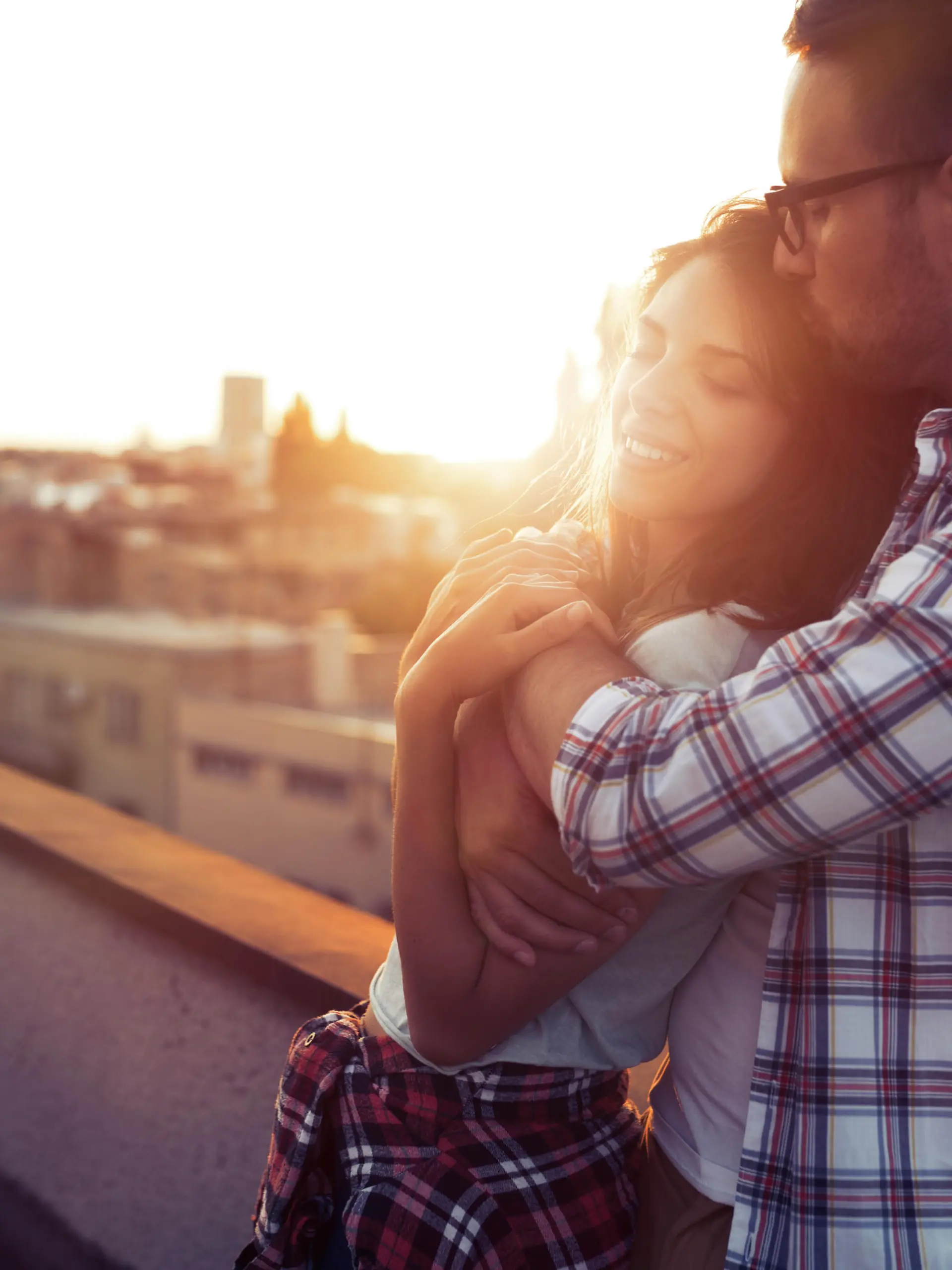 Beautiful young couple in love dating outdoors and smiling