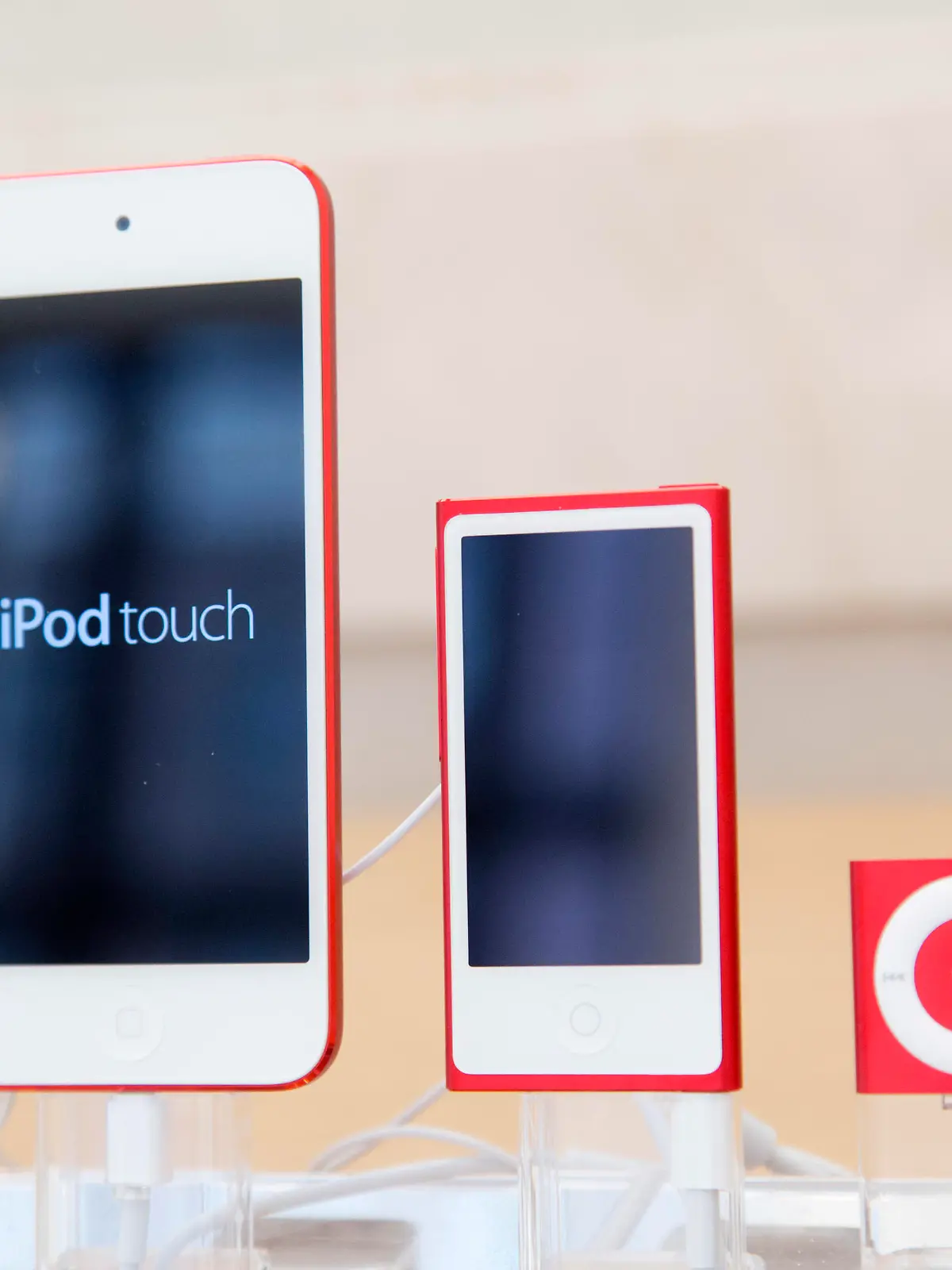 FILE- In this June 11, 2015, file photo, from left, an iPod, iPod Nano and iPod Shuffle are displayed at an Apple store in New York. The company discontinued sales of the iPod Nano and iPod Shuffle on Thursday, July 27, 2017, in a move reflecting the waning popularity of the devices in an era when most people store or stream their tunes on smartphones. (AP Photo/Mark Lennihan, File)